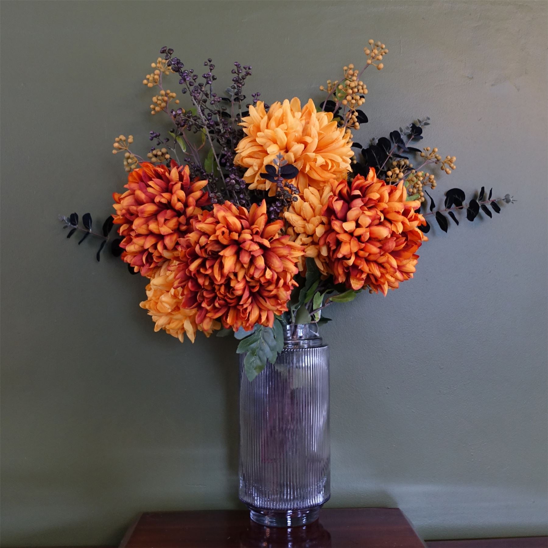 Leaf 65cm Orange and Black Artificial Flower Arrangement in Clear Ridged Glass Vase