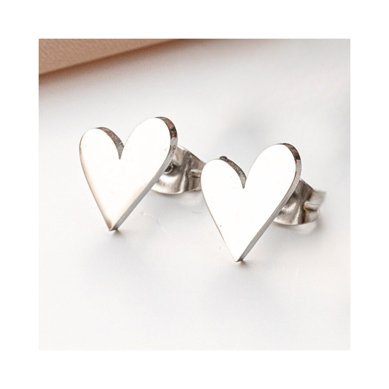 Tilted Heart Stud Earrings in Hypoallergenic Stainless Steel